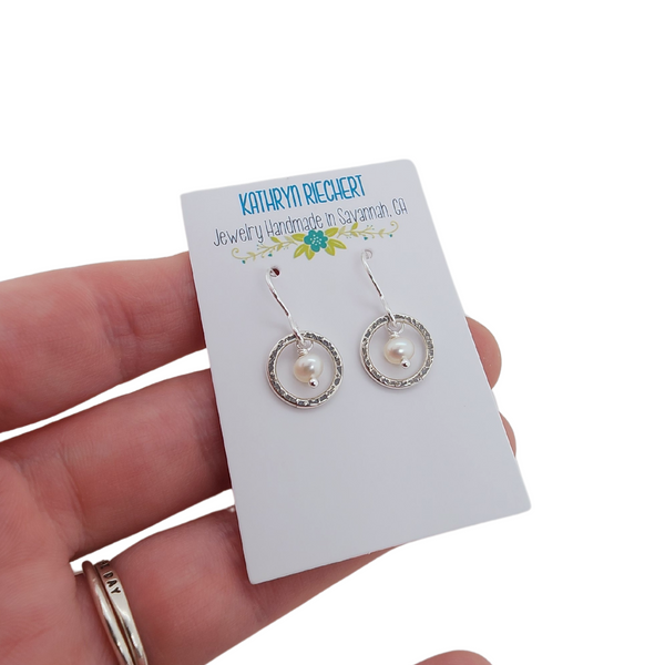 presentation card for Kathryn Riechert's silver circle earrings